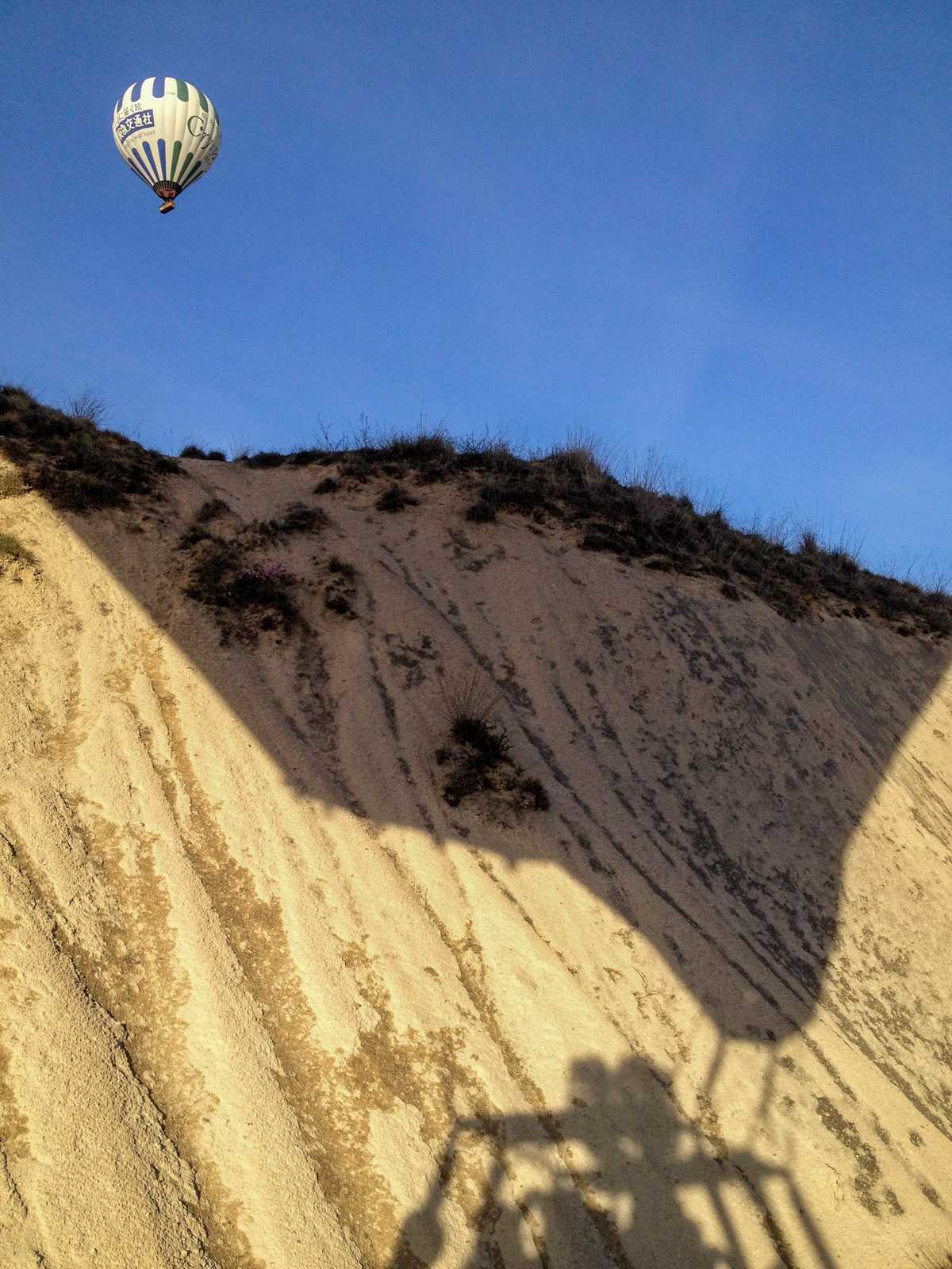 Nap-of-the-earth flying — our own shadow on the hillside